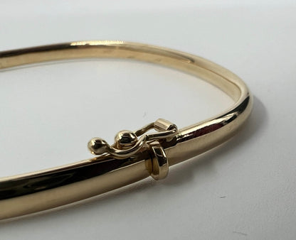 BRACCIALE RIGIDO 18 KT GIALLO